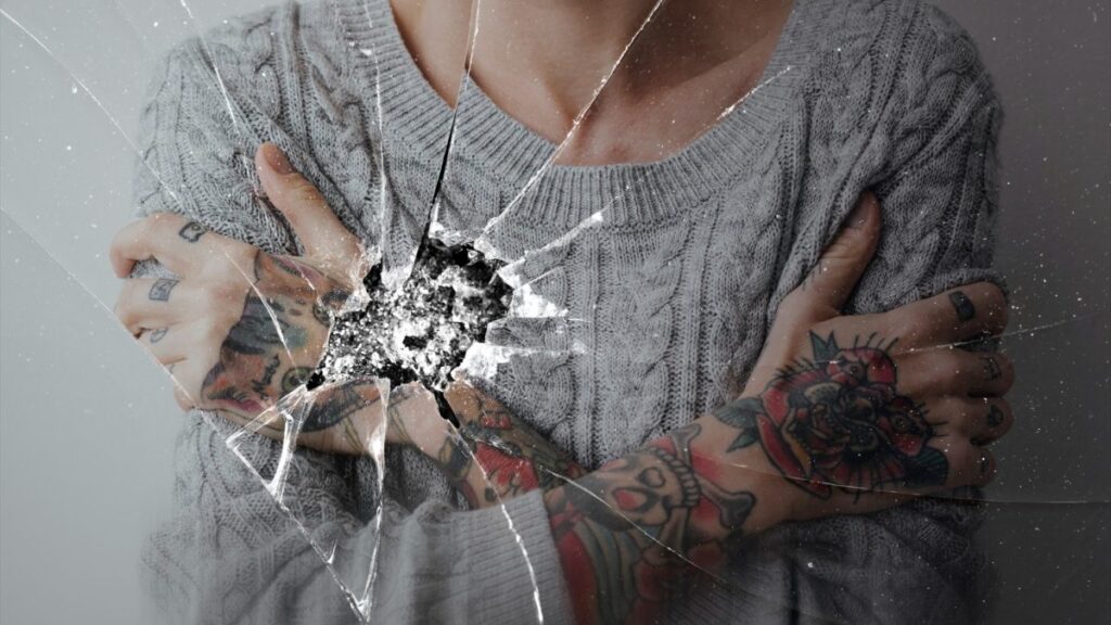cracked glass effect with depressed woman background 1200x675 1